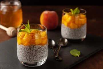 Vegan healthy food. Chia pudding with coconut milk, fresh peaches and honey
