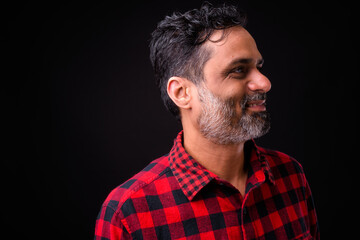 Portrait of mature bearded Indian hipster man