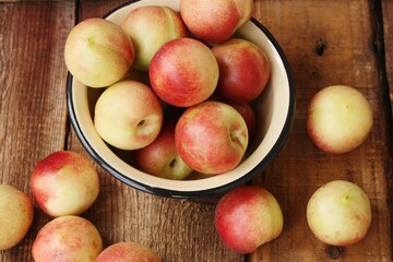Juicy nectarines on a wooden table macro