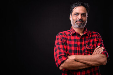 Portrait of mature bearded Indian hipster man