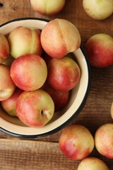 Juicy nectarines on a wooden table macro