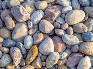 some  colourful stones on the beach of the Baltic Sea form a pattern