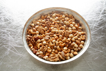 mixed nuts in copper plate