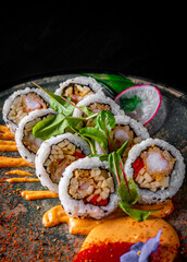 sushi roll in dark plate