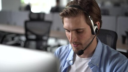 Focused male representative call center agent in wireless headset helping client with complaints using computer in office, corporate operator working in customer support service on helpline telesales - Powered by Adobe