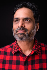 Portrait of mature bearded Indian hipster man