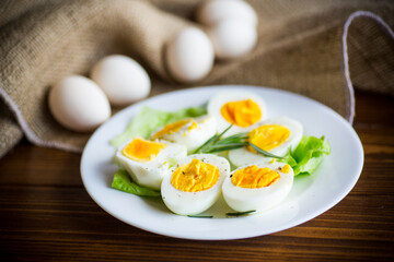 boiled eggs with salad leaves in a plate