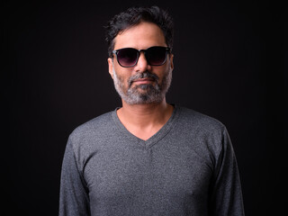 Obraz premium Portrait of mature bearded Indian man with curly hair
