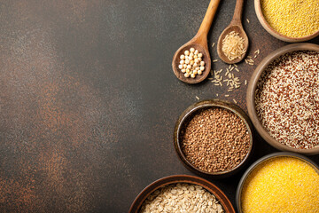 Set with various cereal grains on metallic surface
