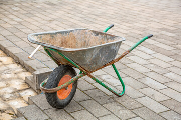 Iron trolley for manual moving of building materials in the garden and in the backyard