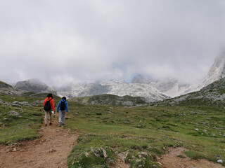 mother and son enjoying hiking in high mountains