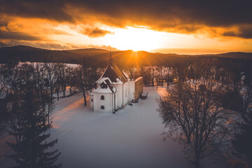 Snow church during sunset