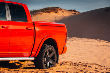 Modern pickup at the middle of desert. Car at the offroad at the huge sands dune during trip - obrazy, fototapety, plakaty