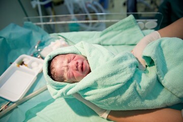 Obraz na płótnie Canvas New born baby in surgery room.