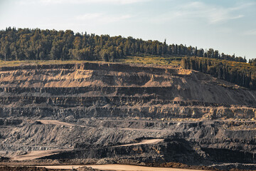 Geological section of soil, layers of coal and rock. Overburden open mine anthracite. Dark texture...