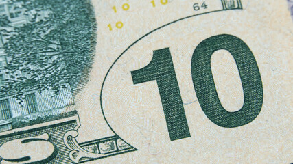 Element of American cash banknote 10 dollars. Macro photography