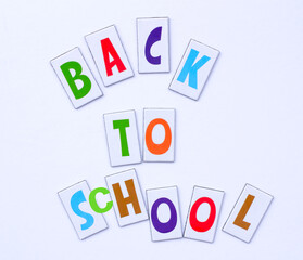 Back to school. Colorful letters and on white background. Flat lay. Education concept