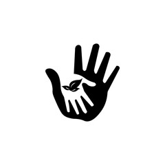 Children's hand in an adult hand and leaflets sign. The future is for the children