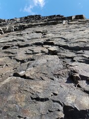 Stone granite rocks against the blue sky