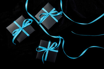 Luxury black gift boxes with blue ribbon - Powered by Adobe