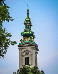 Fototapeta na wymiar Green and golden church tower in Belgrade