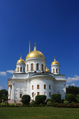 Fototapeta na wymiar Old stone Orthodox Christian church with golden domes