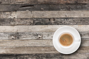 Flat lay Espresso coffee in coffee cup with copy-space on wooden table background.
