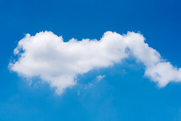 Naklejka na ściany i meble Single nature white cloud on blue sky background in daytime, photo of nature cloud for freedom and nature concept.