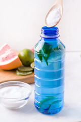 Collagen and lime drink in a bottle vertical photo