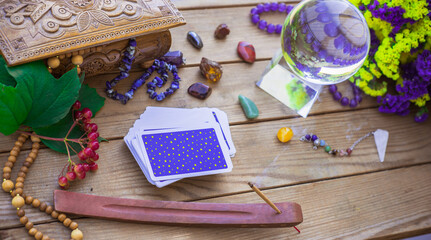 Tarot card on a table, White magic, attributes for witch,  magic for love, health, attracting happiness . Esoteric concept