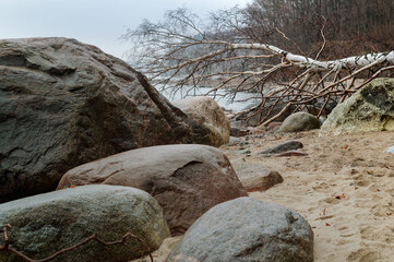 Large stones on the sea shore. Rocky coast of the sea.