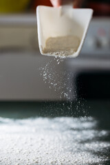 Spilled flour on a green table.