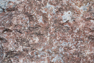 the texture of the stone is red brown