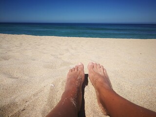 feet on the beach