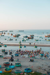 MUI NE / VIETNAM - December 28, 2019 :  view on Fishing village and traditional fishing boat with hundreds boats anchored ( fishing harbour market)