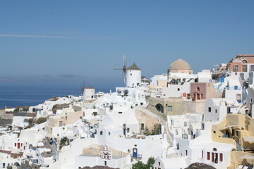 Fototapeta premium White washed windmills in Santorini