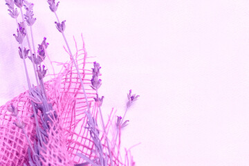 Vintage concept: lavender flowers in jute texture canvas, purple aesthetic