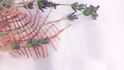 Vintage concept: lavender flowers in jute texture canvas, purple aesthetic, white cloth background,...