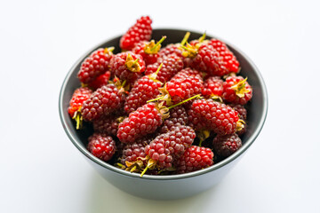 Cup with red ripe blackberries