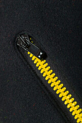 Yellow black pocket zipper, vertical close-up