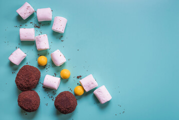 Beautiful blue background with sweets. Texture cakes and bright candy