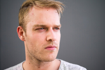 Obraz premium Portrait of young handsome man with blond hair