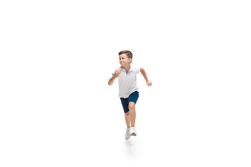 Fototapeta na wymiar Happy kids, little and emotional caucasian boy jumping and running isolated on white background. Look happy, cheerful, sincere. Copyspace for ad. Childhood, education, happiness concept.