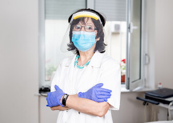 Woman doctor with mask portrait. Pulmologist for covid-19.