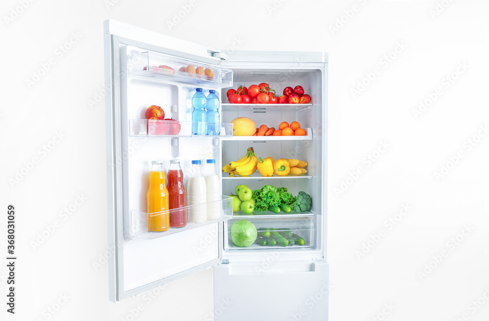 Wall mural open fridge full of vegetables and fruits