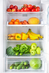 Naklejka na ściany i meble Open fridge full of vegetables and fruits
