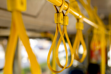 Bus Handles in a Row. Public Transportation. Empty Bus.