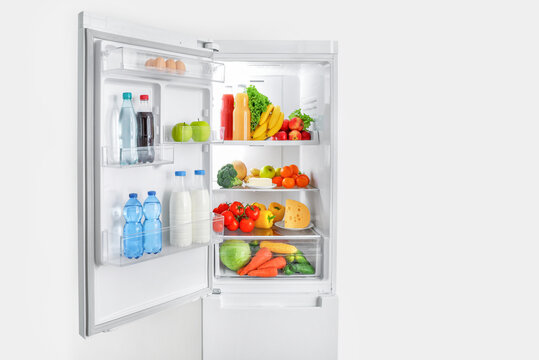 Open Fridge Full Of Vegetables And Fruits