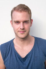 Obraz premium Portrait of young handsome man with blond hair