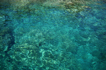 The surface of the clean and transparent Aegean Sea.